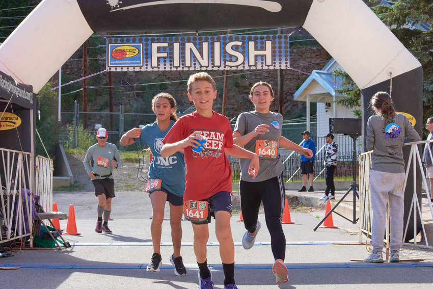 Younger racers finishing the four mile portion of the 2022 Slacker Half Marathon.